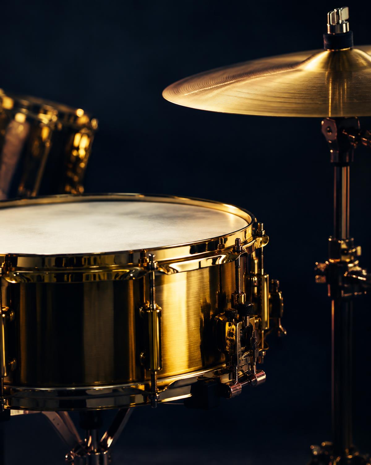A drum kit in warm light